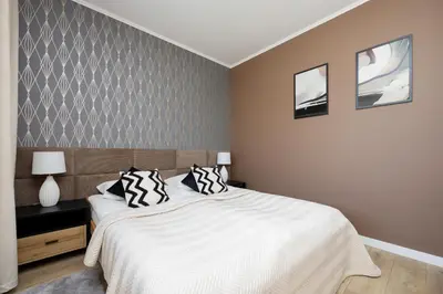 Łóżko lub łóżka w pokoju w obiekcie Nowoczesny Apartament z Parkingiem Warszawa Mokotów by Noclegi Renters