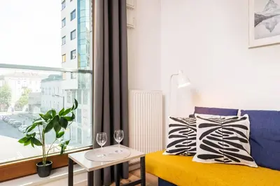 Łóżko lub łóżka w pokoju w obiekcie Riverside Residence Port Praski