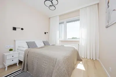 Łóżko lub łóżka w pokoju w obiekcie Stacja Wola Nowoczesny Apartament z Balkonem i Parkingiem Warszawa by Noclegi Renters