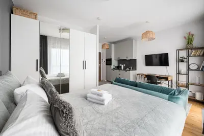 Łóżko lub łóżka w pokoju w obiekcie Wola Pawia Comfort Studio by BookingHost