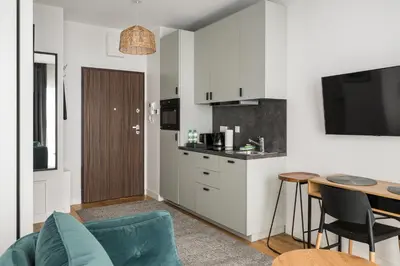 Kuchnia lub aneks kuchenny w obiekcie Wola Pawia Comfort Studio by BookingHost