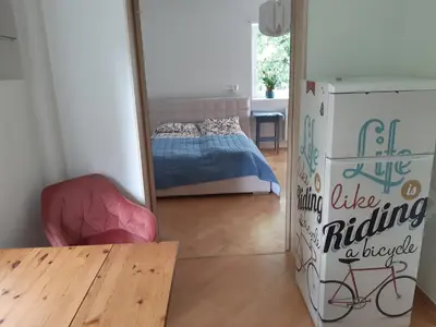 Łóżko lub łóżka w pokoju w obiekcie Karmel Apartment