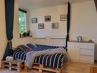 Łóżko lub łóżka w pokoju w obiekcie Cozy Studio Dzielna