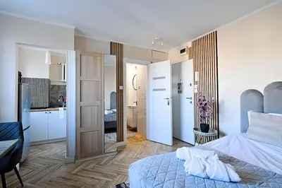 Łóżko lub łóżka w pokoju w obiekcie Privilage Studio Your Home at Emilii Plater 55