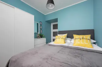 Łóżko lub łóżka w pokoju w obiekcie Apartament na Alejach Jerozolimskich przy Pałacu Kultury i Nauki by Noclegi Renters