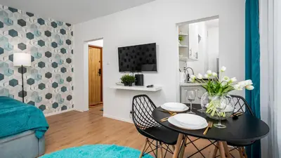 Telewizja i/lub zestaw kina domowego w obiekcie Kasprowicza Apartments - Bielany, Sun & Snow