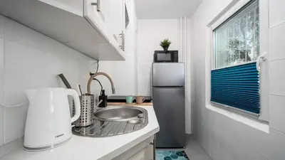 Kuchnia lub aneks kuchenny w obiekcie Kasprowicza Apartments - Bielany, Sun & Snow