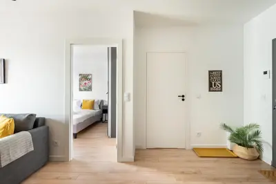 Łóżko lub łóżka w pokoju w obiekcie Wileńska Express Homely Apartment by BookingHost