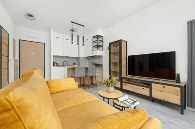 Telewizja i/lub zestaw kina domowego w obiekcie Klimatyczny Apartament na Wilanowie Parking & Balkon by Noclegi Renters