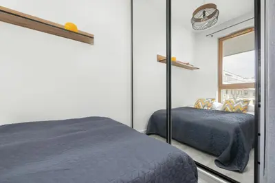 Łóżko lub łóżka w pokoju w obiekcie Klimatyczny Apartament na Wilanowie Parking & Balkon by Noclegi Renters