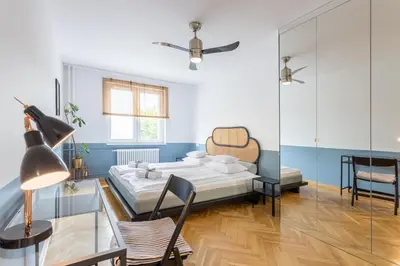 Łóżko lub łóżka w pokoju w obiekcie Marmo Apartments Powiśle