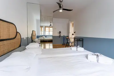 Łóżko lub łóżka w pokoju w obiekcie Marmo Apartments Powiśle