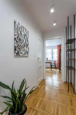 Łóżko lub łóżka w pokoju w obiekcie Marmo Apartments Powiśle