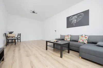 Część wypoczynkowa w obiekcie Nowoczesny Apartament WorkSpace Solipska z Parkingiem by Noclegi Renters
