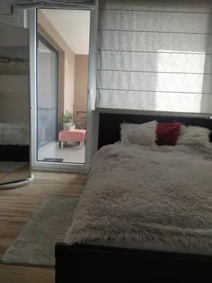 Łóżko lub łóżka w pokoju w obiekcie Apartament Ursus