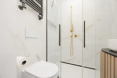 Łazienka w obiekcie Przytulne Studio w Zielonej Okolicy Śródmieścia by Noclegi Renters