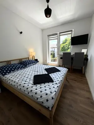 Łóżko lub łóżka w pokoju w obiekcie White House 1