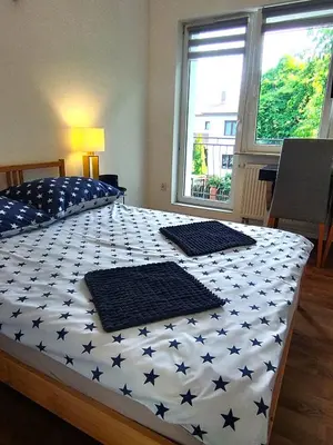 Łóżko lub łóżka w pokoju w obiekcie White House 1