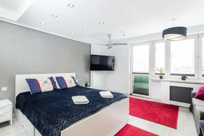 Łóżko lub łóżka w pokoju w obiekcie Beetroot Apartment City Centre Rondo ONZ