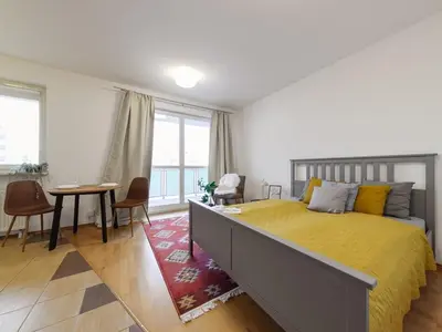 Łóżko lub łóżka w pokoju w obiekcie Etno Chic Studio Ursynow