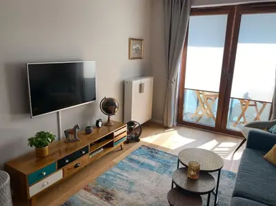Telewizja i/lub zestaw kina domowego w obiekcie Cozy City Appartement Warszawa