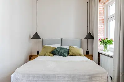 Łóżko lub łóżka w pokoju w obiekcie Mińska Apartament