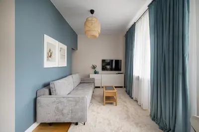 Telewizja i/lub zestaw kina domowego w obiekcie Wola Ratusz Homely Apartment by BookingHost
