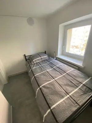 Łóżko lub łóżka w pokoju w obiekcie Hostel Harmonia