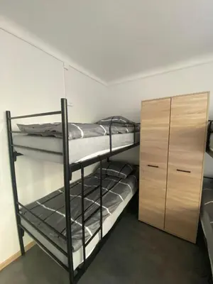 Łóżko lub łóżka w pokoju w obiekcie Hostel Harmonia