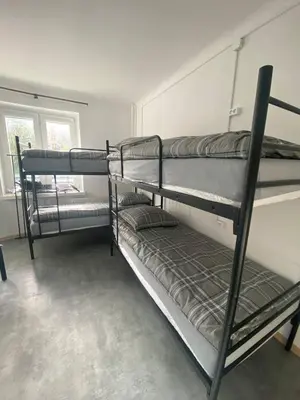 Łóżko lub łóżka w pokoju w obiekcie Hostel Harmonia