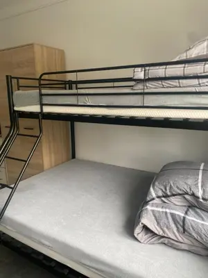 Łóżko lub łóżka w pokoju w obiekcie Hostel Harmonia