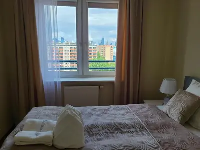 Łóżko lub łóżka w pokoju w obiekcie APARTAMENT PANORAMA w360