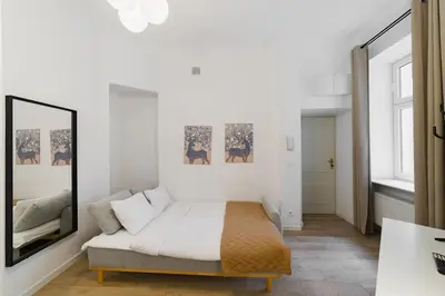 Łóżko lub łóżka w pokoju w obiekcie Nowoczesne studio w Сentrum