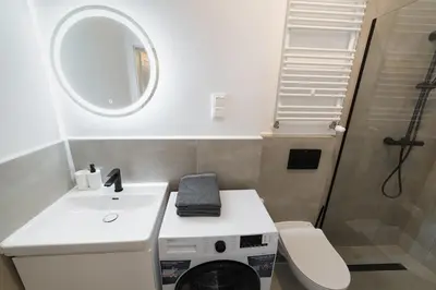 Łazienka w obiekcie Nowoczesne studio w Сentrum