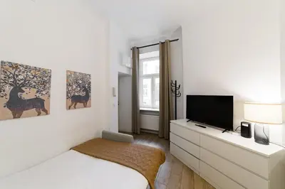 Łóżko lub łóżka w pokoju w obiekcie Nowoczesne studio w Сentrum