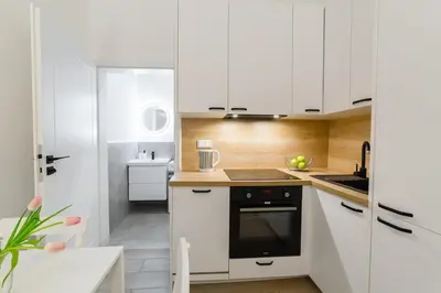 Kuchnia lub aneks kuchenny w obiekcie Nowoczesne studio w Сentrum