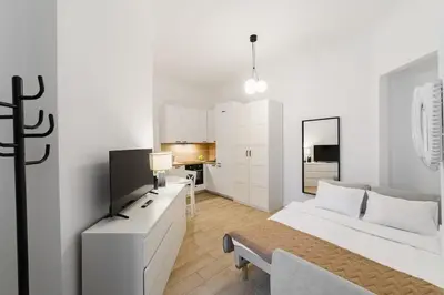 Łóżko lub łóżka w pokoju w obiekcie Nowoczesne studio w Сentrum