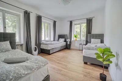 Łóżko lub łóżka w pokoju w obiekcie Warsaw Premium Apartments Boczna