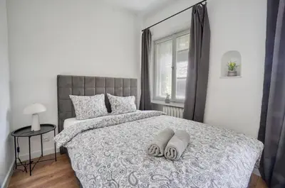 Łóżko lub łóżka w pokoju w obiekcie Warsaw Premium Apartments Boczna