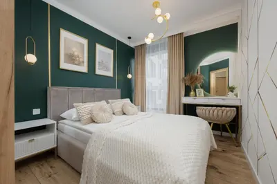 Łóżko lub łóżka w pokoju w obiekcie Herbu Oksza Elegant Apartment with Parking by Noclegi Renters