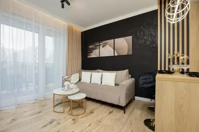 Część wypoczynkowa w obiekcie Herbu Oksza Elegant Apartment with Parking by Noclegi Renters