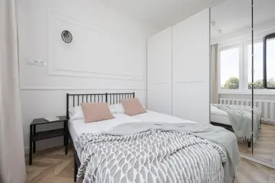 Łóżko lub łóżka w pokoju w obiekcie Elegancki Apartament dla 4 osób w Warszawie by Noclegi Renters