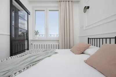 Łóżko lub łóżka w pokoju w obiekcie Elegancki Apartament dla 4 osób w Warszawie by Noclegi Renters