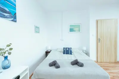 Łóżko lub łóżka w pokoju w obiekcie Hostel Metro Kabaty