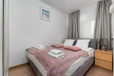 Łóżko lub łóżka w pokoju w obiekcie Marszałkowska 111A by Homeprime
