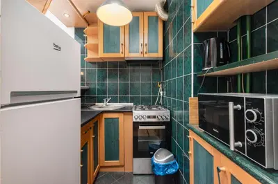 Kuchnia lub aneks kuchenny w obiekcie Marszałkowska 111A by Homeprime