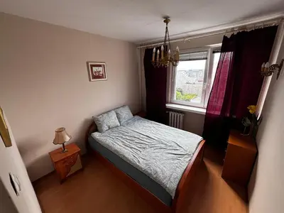 Łóżko lub łóżka w pokoju w obiekcie Mieszkanie RETRO 57m2