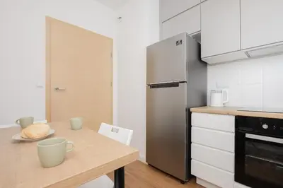 Kuchnia lub aneks kuchenny w obiekcie Słoneczny Apartament z Parkingiem by Noclegi Renters