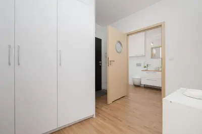 Łóżko lub łóżka w pokoju w obiekcie Słoneczny Apartament z Parkingiem by Noclegi Renters