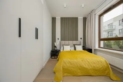 Łóżko lub łóżka w pokoju w obiekcie Spacious Family Apartment with Garden & Parking by Noclegi Renters